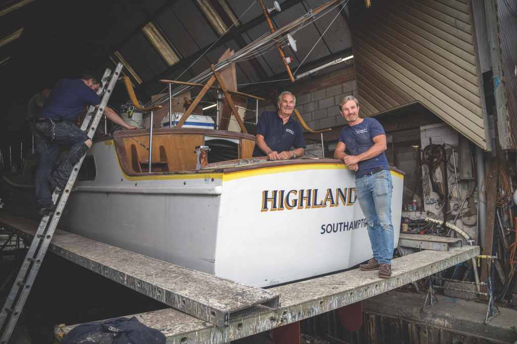 Michael and Stephen copy Founder Michael Dennett (left, in the cockpit) and his son Stephen. Refits and renovations are their stock and trade. PHOTO COURTESY MICHAEL DENNETT BOAT BUILDERS