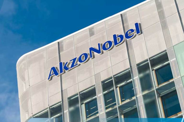 a stone office building with AKZONOBEL written on the outside