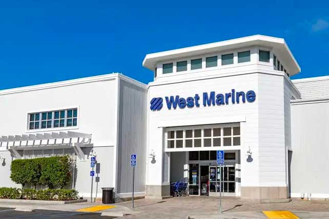 1_CEOBONUSES-260612 A large white building with West Marine in blue lettering