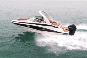 Smaller, fast motorboat cutting across the water