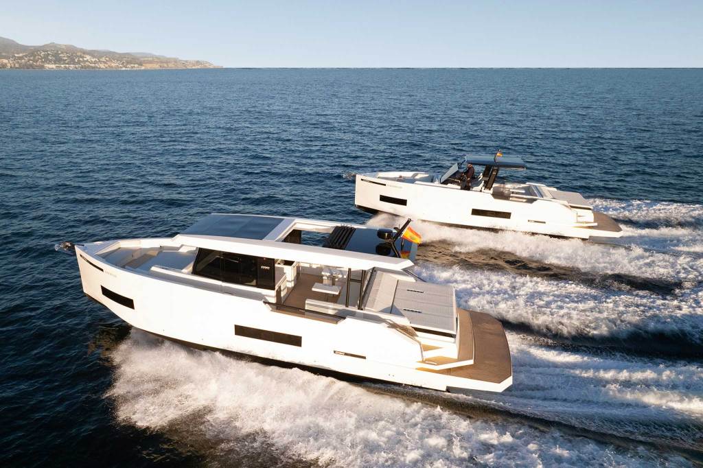 Two motor boats racing across the water.