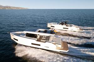 Two motor boats racing across the water.