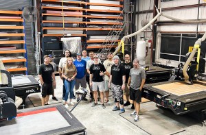 A group of people standing in a large warehouse