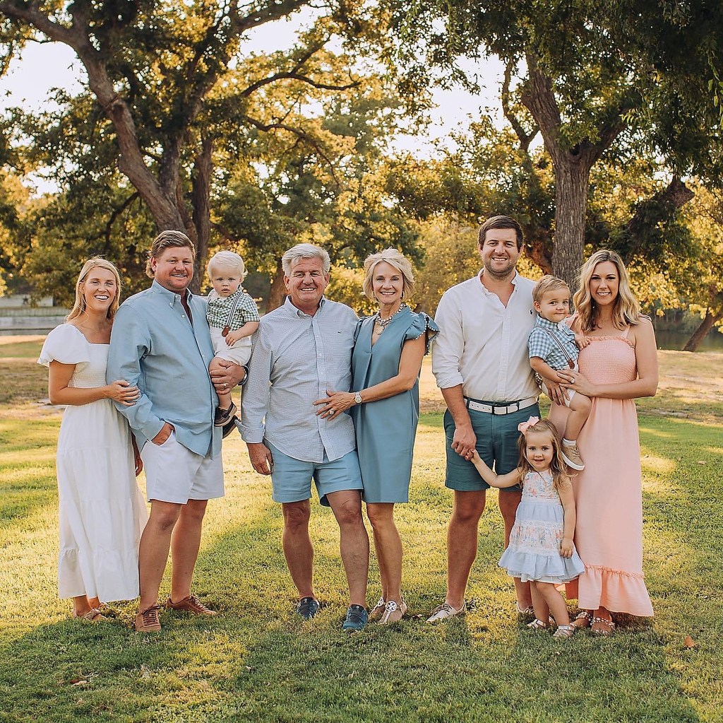 Clayton and Karen Raven (center) and sons Clay (left), with his family, and Cody (right), with his family. PHOTO COURTESY BOAT TOWN
