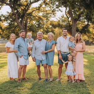 Clayton and Karen Raven (center) and sons Clay (left), with his family, and Cody (right), with his family. PHOTO COURTESY BOAT TOWN