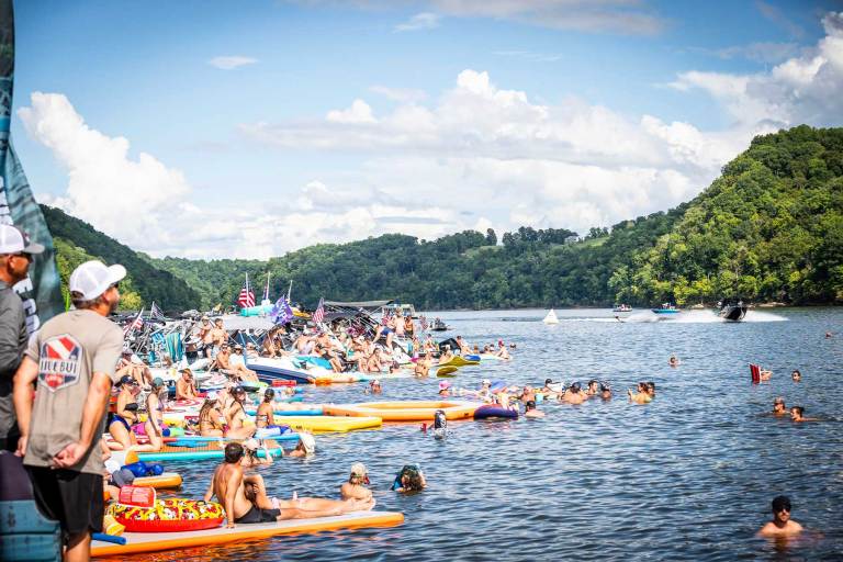 Beach scene of people and boats