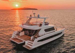 Large motorboat at sunset.