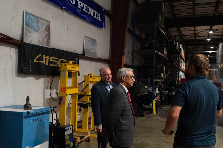 Sen. Tim Kaine (left) and Rep. Bobby Scott learn about training the skilled workforce that supports Volvo Penta’s marine and industrial technologies. PHOTO COURTESY VOLVO PENTA