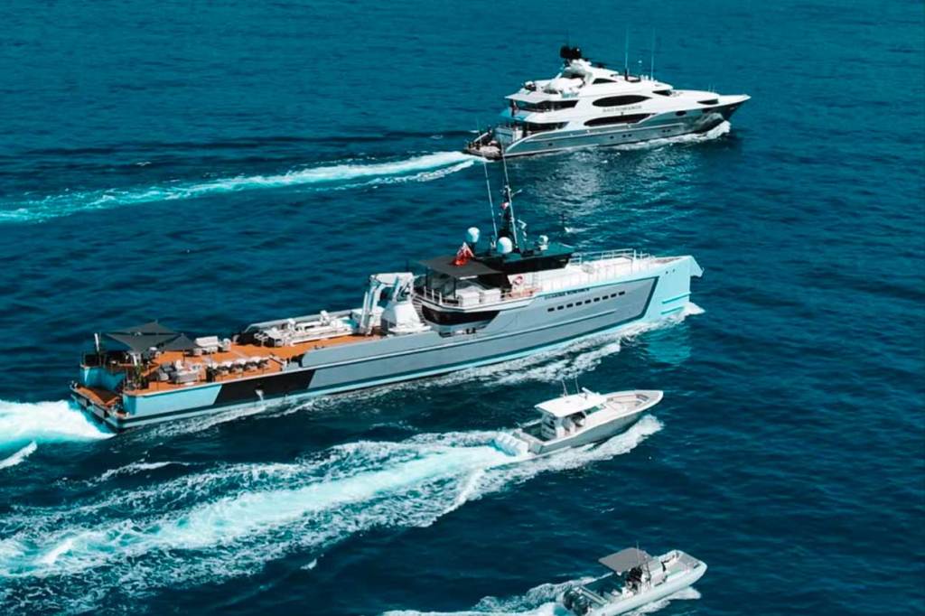 various sizedmotorboats cutting across the water