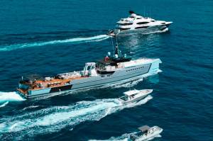 various sizedmotorboats cutting across the water